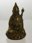 A 19th Century Brass Figure of Buddha, seated on a lotus base in a contemplative posture, with