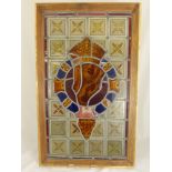 A Stained Glass Window depicting a Regimental Insignia, approx 35 x 63 cms, framed.