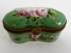 A Limoges Gilt and Enamel Pill Box, the hand painted box depicting flowers with impressed marks to