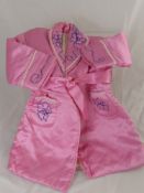 A Vintage Child's Quilted Dressing Gown, together with a model of the Royal State Coach by