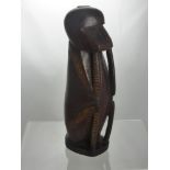 An Antique South Seas Hardwood Carving of a Monkey, depicted seated on its haunches, having