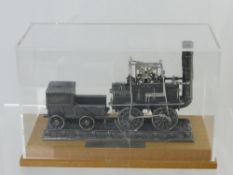 A Bachmann Pewter 00 Gauge Static Model of the 1825 Steam Locomotive, "Locomotion" set on a wooden