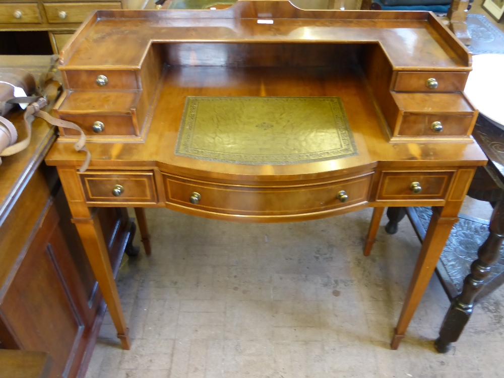 A Reproduction Maple and Mahogany Escritoire, the desk having a bow front with four drawers to top