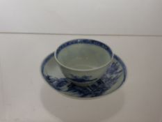 Blue and White Nankin Cargo Ware Tea Bowl and Saucer, depicting mountain scenes.