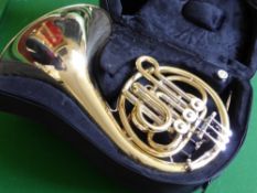 A Bass Silver and Lacquer French Horn, by J. Michael, in the original case.