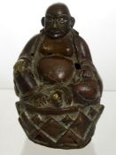 A 19th Century Copper Figure of Buddha, seated on a lotus base in contemplative posture, with
