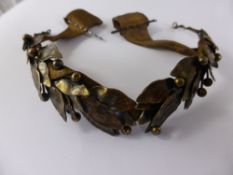 A Vintage Bronze Metal Silver Laurel Leaf Tiara, on a silk tie.