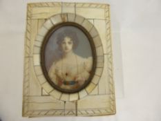 An Ivorine Framed Miniature, depicting a young woman, signed Reny.