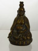 A 19th Century Brass Figure of Buddha, seated on a lotus base in a contemplative posture, Buddhist