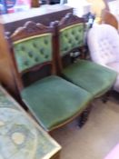 Two Velvet Covered Edwardian Mahogany Salon Chairs, the chairs carved with fruit on turned feet (