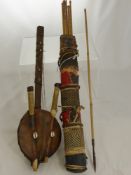 An Antique Tribal Quiver and Arrows, the quiver of red linen, basket weave and hide trim, containing