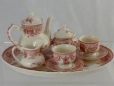 A Child's Miniature "Toile" Tea Set, comprising tea pot, sugar bowl, milk jug, cups and saucers