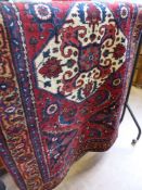 A Vintage Persian "Lillian" Woolen Carpet, approx 103 x 170 cms