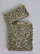 An Indian Silver Card Case, with embossed floral design.