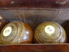 Two Sets of Antique Bowling Balls together with a white throwing ball F.H Ayres, London set in