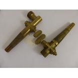 A Pair of Brass Beer Barrel Taps one unmarked and the other bearing a cross together with An Oak