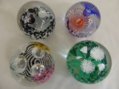 Four Caithness Glass Paper Weights, including  "Luscious Lashes" black/white, a second entitled "