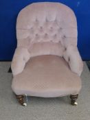 Victorian Button Back Nursery Chair, turned feet on porcelain castors.