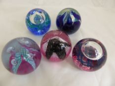 Five Caithness Glass Paper Weights, including "Feathers" dark blue, "Check Point" pink/green, "