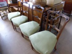 Four Rosewood and Bird's Eye Maple dining chairs with floral cameo backs, pale green covered