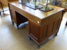 A Mahogany Edwardian Twin Pedestal Desk, the desk having a brown leather tooled insert with one