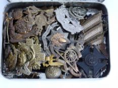 A Tin Containing approximately 30 military badges, including Lancashire Fusilier's, Cheshire,