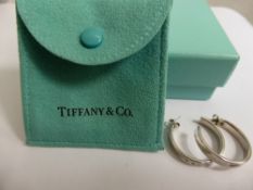 A Pair of Tiffany & Co., C2003 925 Hallmark Hoop Earrings, the earrings in original suede pouch with