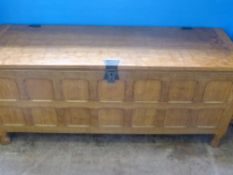 A  Sid Pollard Oak Blanket  Chest,  the chest having panelled  front  and  sides, 128 x 42 x 54 cms,