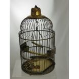 An Antique Brass Canary Cage, the cage having ceiling hook with hanging perch, feeding bowl and