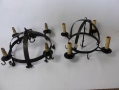 A Wrought Iron Four Branch Spherical Ceiling Light, approx 64 x 64 cms together with another wrought
