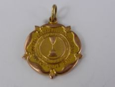 A 9ct Gold Presentation Medallion, the medallion reads "Sutton Coldfield and North Birmningham