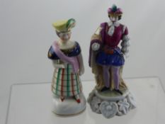 A Porcelain Figurine wearing a sword in 17th century attire, together with Staffordshire 19th
