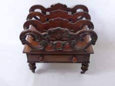 A Victorian Mahogany Canterbury, the Canterbury having three sections with shell design to front