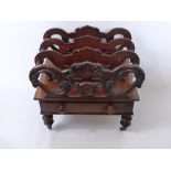 A Victorian Mahogany Canterbury, the Canterbury having three sections with shell design to front