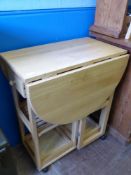 A Pine Drop Leaf Butchers Side Table, together with three stools approx 72 x 44 x 83 cms