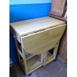 A Pine Drop Leaf Butchers Side Table, together with three stools approx 72 x 44 x 83 cms