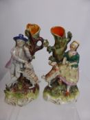 A Pair of 19th Century Staffordshire Spill Vases, depicting shepherd and shepherdess, approx 22 cms