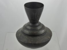 An Islamic Cairoware 19th Century Vase inlaid with silver and copper approx 26 cms high.