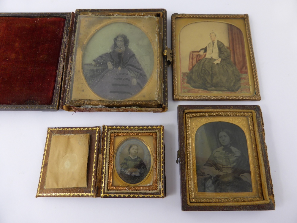 A Collection of Four Victorian Dagliotypes, in the original gilt framed leather cases.