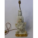 An Antique Blanc de Chine Table Lamp Base, in the form of Guayin with a smaller figure in her lap,