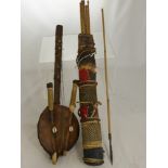 An Antique Tribal Quiver and Arrows, the quiver of red linen, basket weave and hide trim, containing