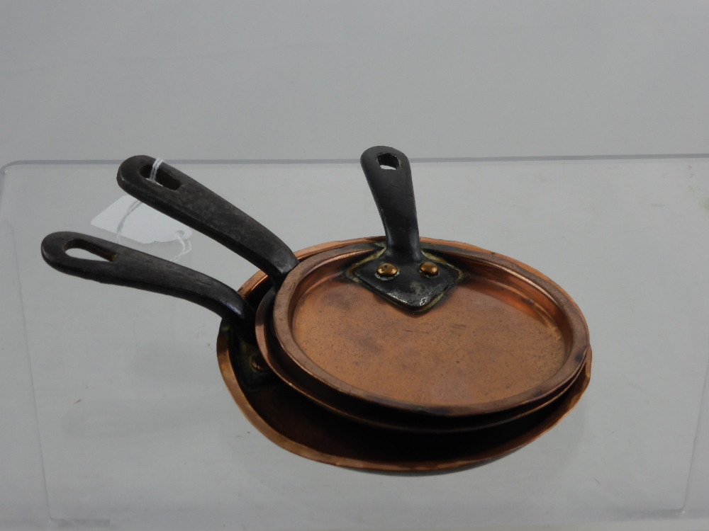 A Collection of Three Miniature Antique Copper Saucepan Lids with iron handles. (3)