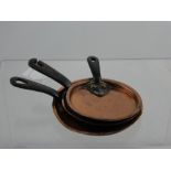 A Collection of Three Miniature Antique Copper Saucepan Lids with iron handles. (3)