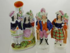 19th Century Staffordshire Figurines, depicting a Highland Lady and Gentleman, together with a spill