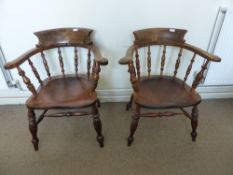Two Mahogany Captain's Chairs, with turned legs and stretchers.
