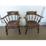 Two Mahogany Captain's Chairs, with turned legs and stretchers.