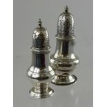 Two Antique Solid Silver Georgian Peppers, London hallmark, the first dated 1820 m.m R J (damage