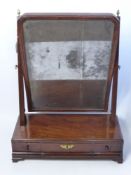 A Georgian Mahogany Toilet Mirror, original mirror hung from square pillar supports topped with