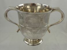 A Georgian Double Handled Cup, the cup having swan neck handles with thumb rests, with simple ribbed