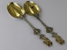 A Pair of Victorian Apostle Serving Spoons, the heart form spoons having dolphin formed twisted stem